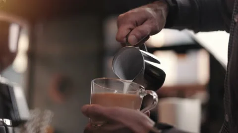 Professional man making pouring stream milk with espresso Stock Footage 188908352
