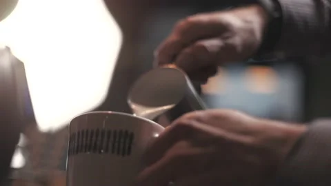 Professional man making pouring stream milk with espresso Stock Footage 189368483