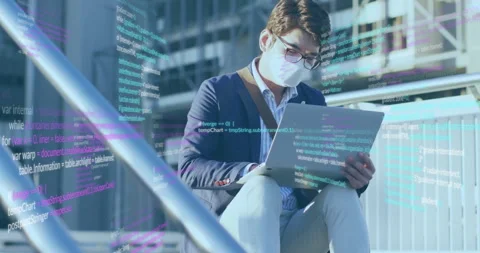 Professional man opening laptop on steps, activating code overlay while Stock-Footage 312004690