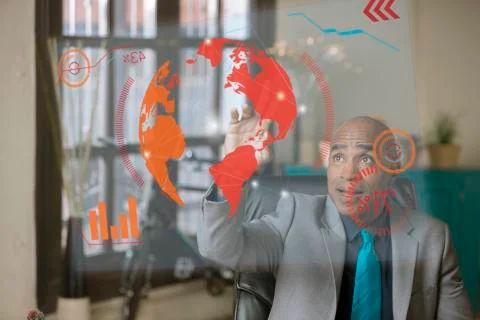 Professional Man Operating a Futuristic Computer Screen Stock Photos