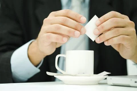 Professional man preparing cup of coffee, cropped view of hands Stock Photos