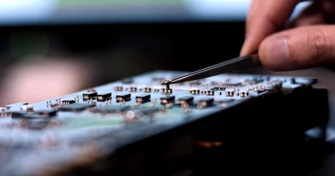 A professional man repairs a graphics card. Stock Footage 102172756
