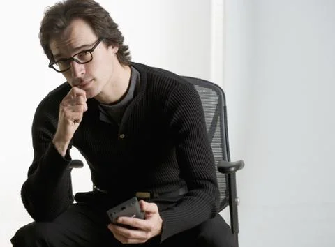 Professional man sitting thoughtfully 스톡 사진