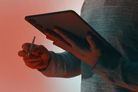 Professional man using modern touchpad computer with electronic pen for digit Stock Photos