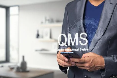 Professional Man Using Smartphone for Quality Management System 스톡 사진