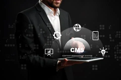 Professional man using a tablet to discuss content management system technology Foto stock
