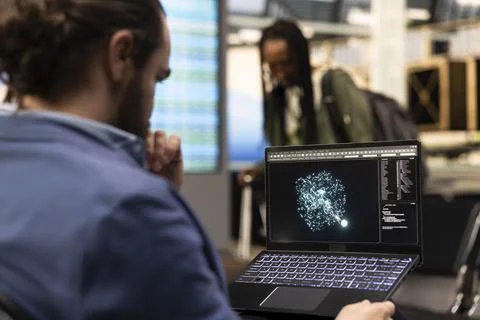 Professional man working with artificial intelligence software on laptop Stock Photos