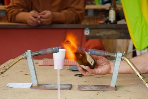 Professional man working a bottle with fire Stock Photos