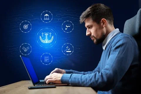 Professional man working on laptop with digital icons representing law and Stock Photos