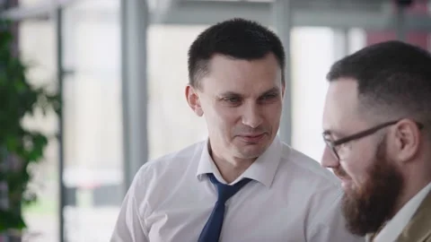 A professional manager advises the client on the purchase of a financial product Stock Footage 202264496