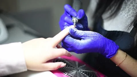 Professional manicure master files nails , preparation for polishing with Stock Footage 238902228