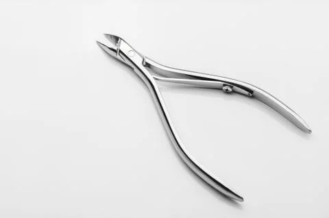 Professional manicure tools on a white background. Cuticle nipper Stock Photos