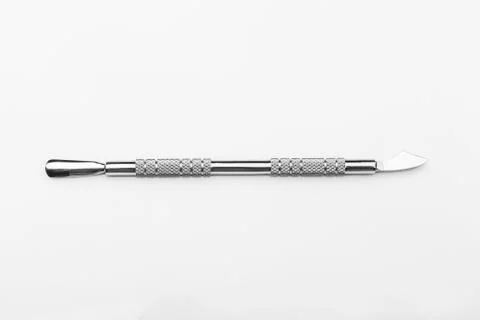 Professional manicure tools on a white background. Cuticle pusher Stock Photos