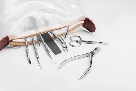 Professional manicure tools on a white background. Stock Photos
