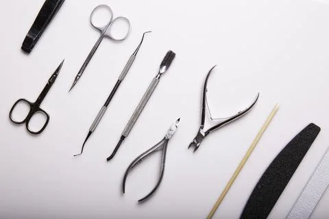 Professional manicure tools on a white background. Stock Photos