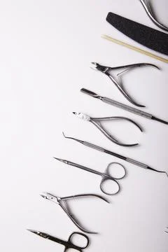 Professional manicure tools on a white background. Stock Photos