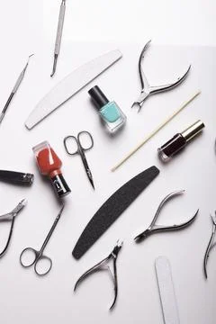 Professional manicure tools on a white background. Stock Photos