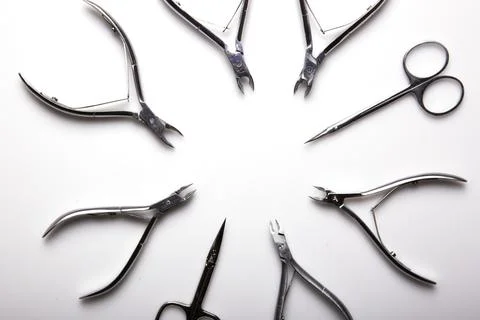 Professional manicure tools on a white background. Stock Photos