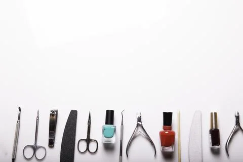 Professional manicure tools on a white background. Stock Photos