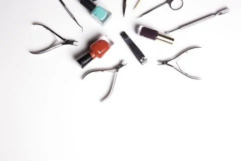 Professional manicure tools on a white background. Stock Photos