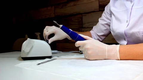Professional manicurist switch on nail drill in nail beauty salon Stock Footage 170122797