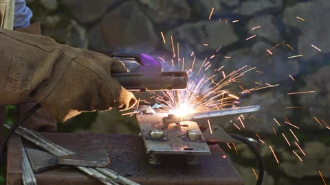 Professional Manual Arc Welding Process with Bright Sparks in a Workshop Stock-Footage 337424668