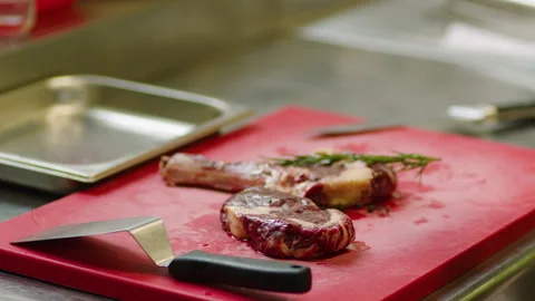 Professional marinating of meat in the restaurant kitchen Stockbeeldmateriaal 232562423