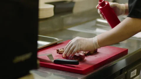 Professional marinating of meat in the restaurant kitchen Stock Footage 232562453