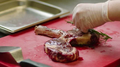 Professional marinating of meat in the restaurant kitchen Stock Footage 232562798
