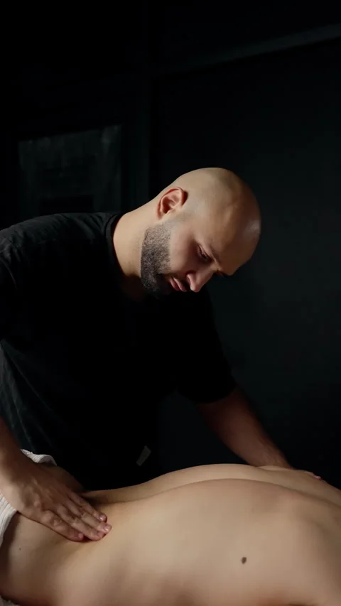 Professional massage therapist using deep tissue technique, pressing hands Video stock 300351413