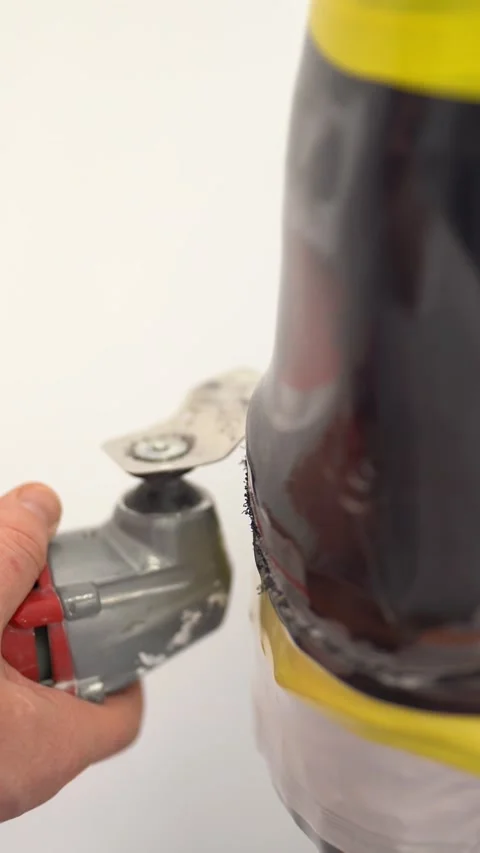 Professional master cutting prosthetic limb mold in workshop. Vertical video Stock Footage 237607307