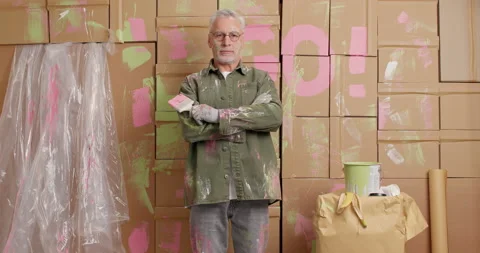 Professional mature man decorator keeps arms folded looks self cofident at Stock Footage 144922604