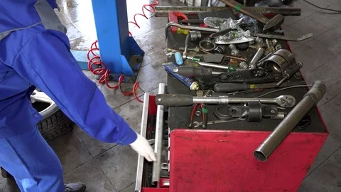 Professional mechanic looking for tools in drawer box Video stock 75401238