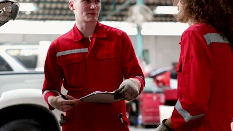 Professional mechanic team using technology notepad estimate and consulting.. Stock Footage 243721781