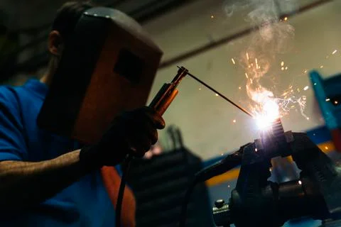 Professional Mechanic welding. Stock Photos