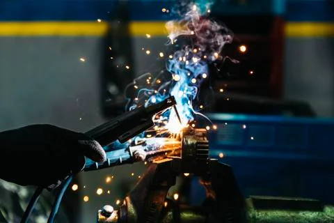 Professional Mechanic welding. Stock Photos