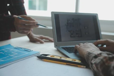 Professional Mechanical Engineer team Working on Personal Computer at Metal.. Stock Photos