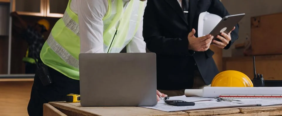 Professional Mechanical Engineer team Working on Personal Computer at Metal.. Stock Photos