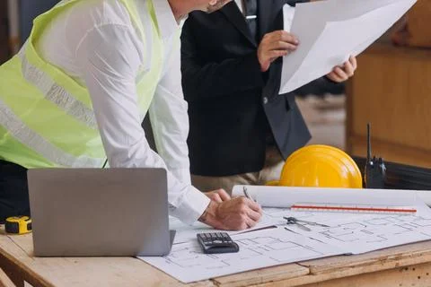 Professional Mechanical Engineer team Working on Personal Computer at Metal.. Stock Photos