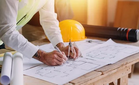 Professional Mechanical Engineer team Working on Personal Computer at Metal.. Stock Photos