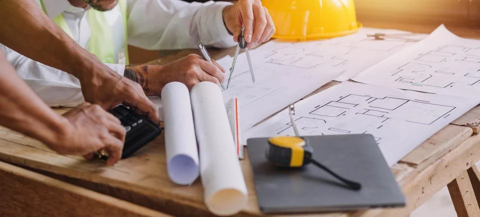 Professional Mechanical Engineer team Working on Personal Computer at Metal.. Stock Photos