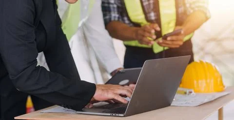 Professional Mechanical Engineer team Working on Personal Computer at Metal.. Stock Photos