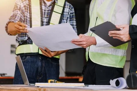 Professional Mechanical Engineer team Working on Personal Computer at Metal.. Stock Photos