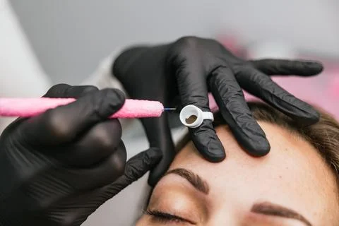 Professional microblading procedure for perfect eyebrows Stock Photos