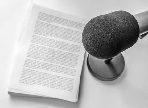 Professional microphone and text on sheets of paper Fotos de archivo