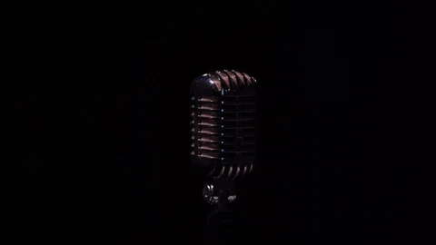 Professional microphone for record or speak to audience on stage in dark close. Stock Footage 118544235