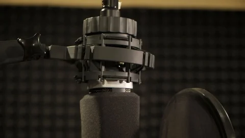 Professional microphone in the recording studio, microphone near wall with Stockbeeldmateriaal 128186703