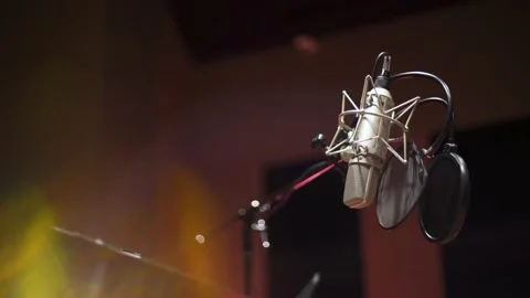 Professional Microphone in Sound Recording Studio with Light Flare in Foreground Stock Footage 174679358