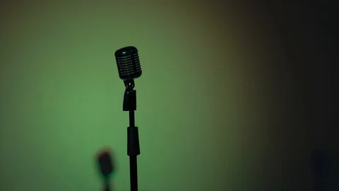 Professional microphone for speak to audience on stand in dark retro club. Stock Footage 118527023