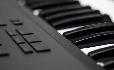 Professional midi keyboard synthesizer with knobs and controllers. Stock Photos